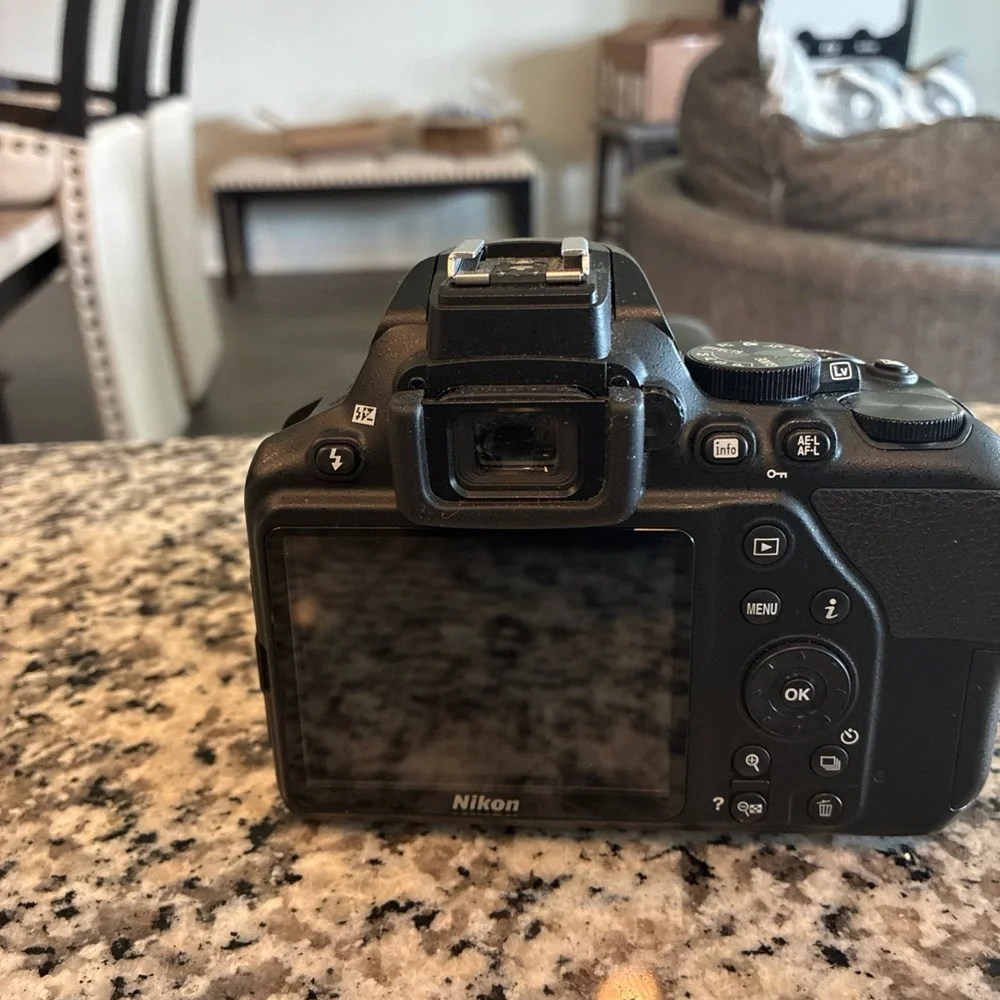 Nikon Black Digital Camera with Ergonomic Design and Professional Lens
